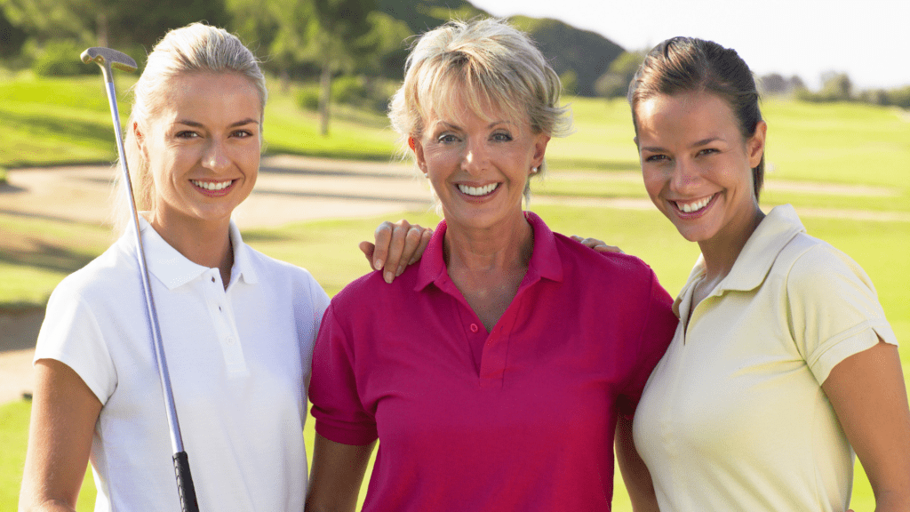 Greatest Golf Quotes for life inspiration show three ladies working together smiling with their golf clubs.