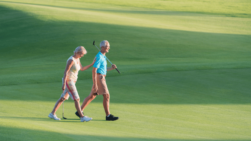Is Golf a Sport?  A couple walking together on the green debating this long asked question.