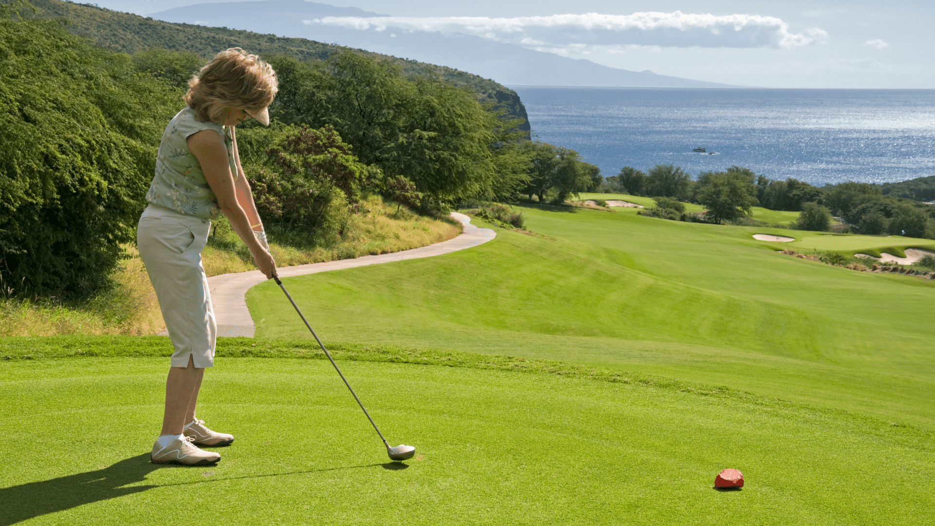 Best Golf Clubs for Senior Women - Ladies / Woman golfer teeing off