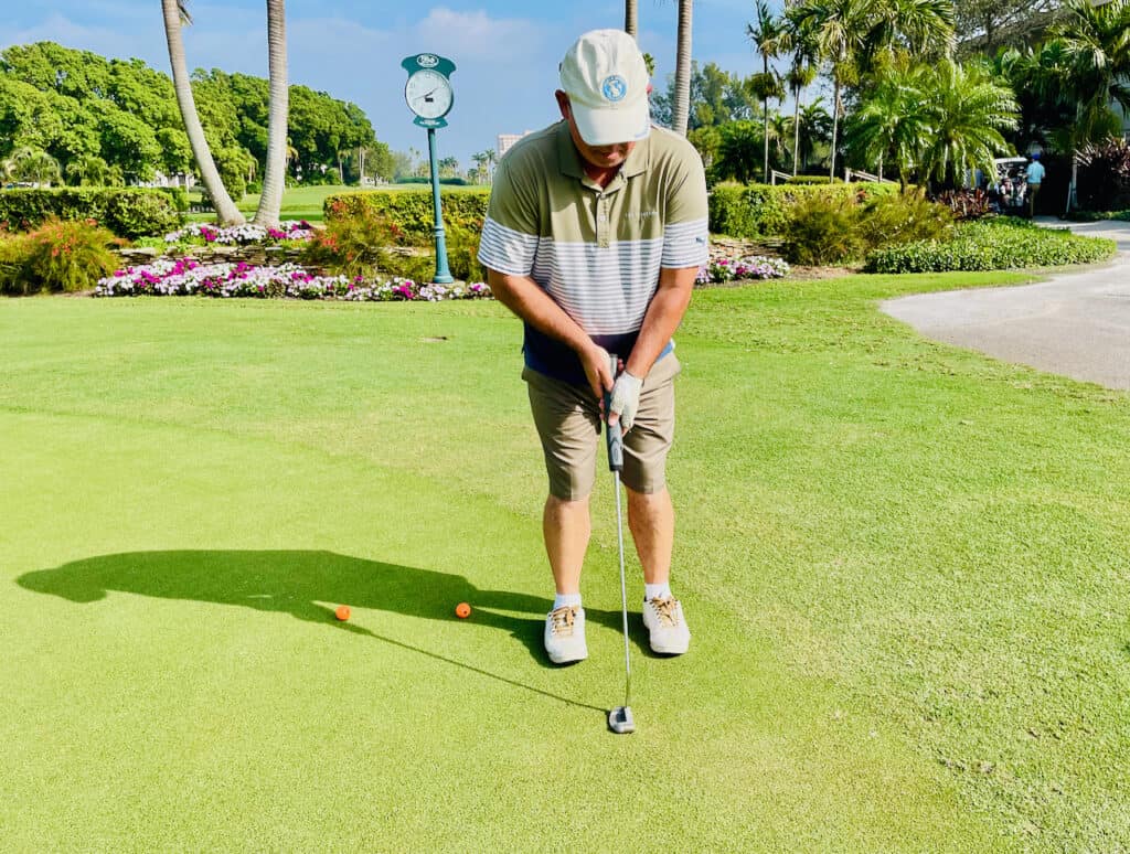 Left Hand Low Putting Grip with golfer on the green.