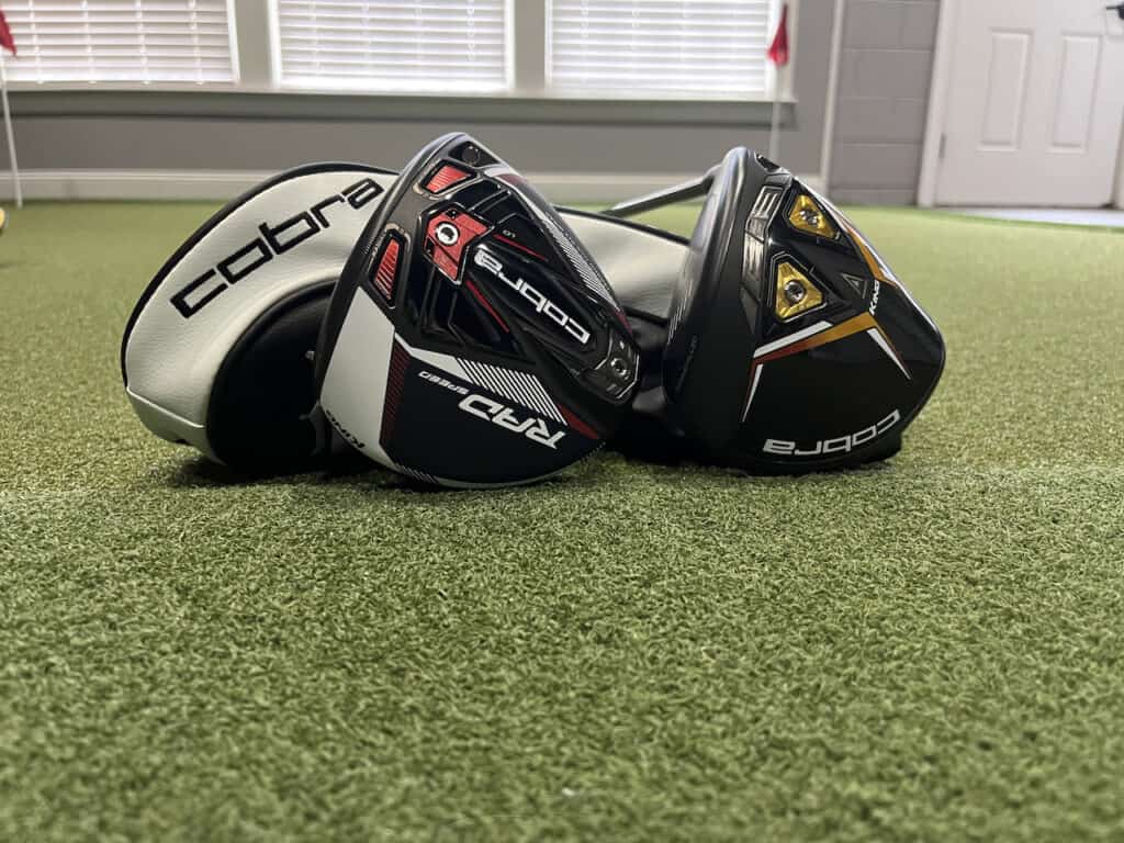 Cobra Radspeed vs Cobra LTDX Drivers with covers laying on the ground.