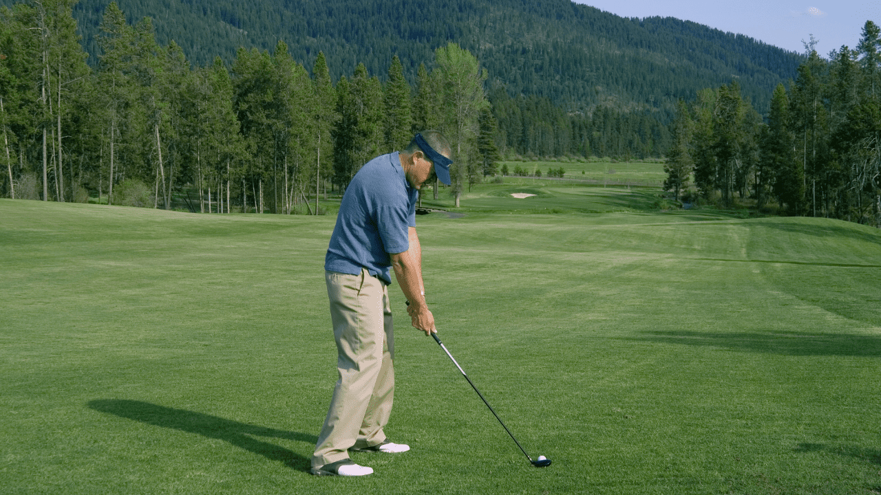 most forgiving fairway woods - showing golfer using his club on the fairway