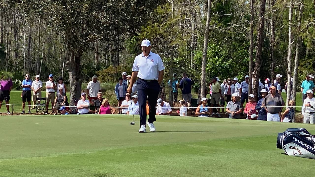 Retief Goosen WITB showing him walking back to his golf ball laying just off the golf green on the Tiburon Golf Course in Feb 2023.