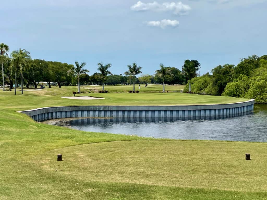 Enjoying the outdoors is one of the mental health benefits of golf.  Showing a beautiful golf course in Florida.